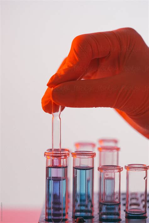 Chemist Dropping Liquid Into Test Tube By Stocksy Contributor Ani