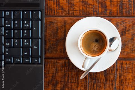 Laptop and coffee Stock Photo | Adobe Stock