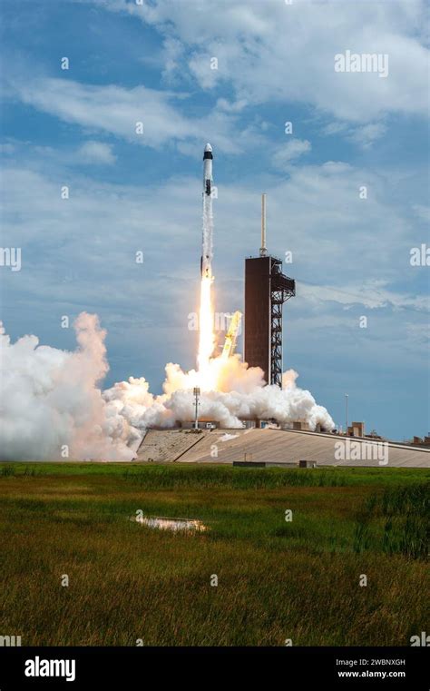 A Spacex Falcon 9 Rocket And Crew Dragon Spacecraft Lifts Off From