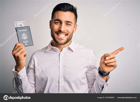 Young Handsome Tourist Man Holding United States Passport Dollars Very