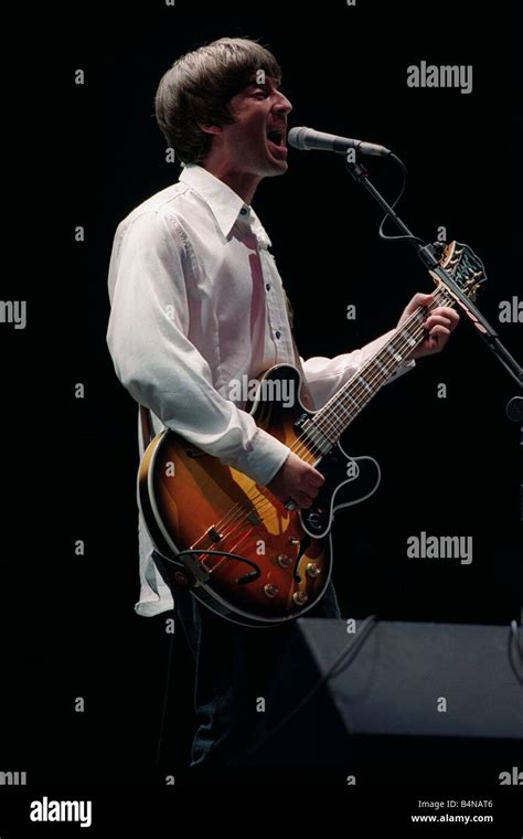 Noel Gallagher Of The Pop Group Oasis On Stage Singing And Playing Guitar At Loch Lomond Concert