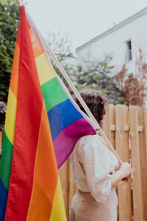 Person Holding A Traditional Gay Pride Flag Photos By Canva