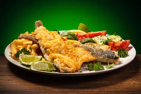 Premium Photo Fried Fish And Vegetables