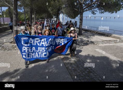 Activists Are Seen Marching With Banners In Defense Of The Environment