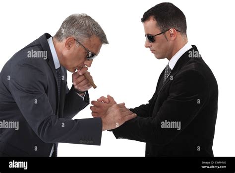 Mobster Helping His Boss Light A Cigar Stock Photo Alamy