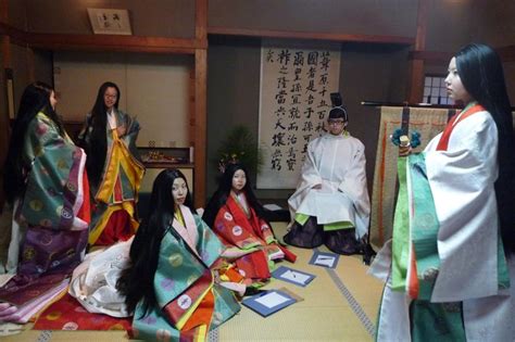 A Man And A Group Of Women Dressed In Heian Robes At A Junihitoe