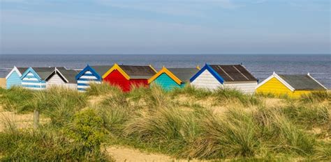 Premium Photo Colourful Beach Huts