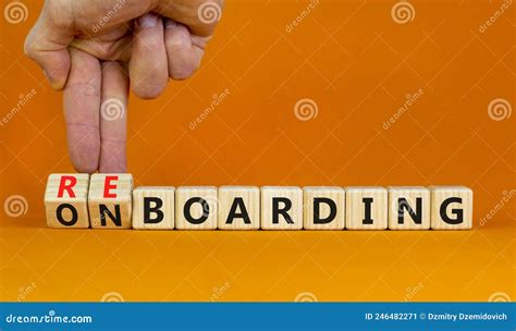 Onboarding Or Reboarding Symbol Businessman Turns Wooden Cubes And