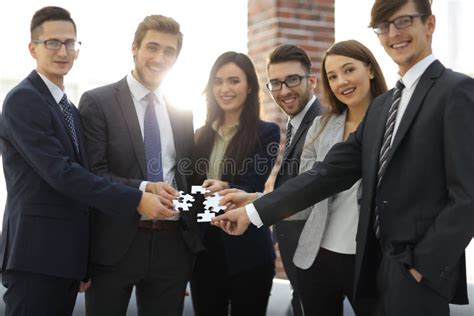 Group Of Business People Assembling Jigsaw Puzzle Team Support Stock