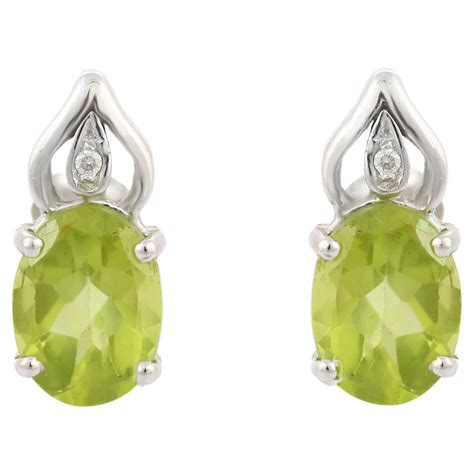 Green Oval Peridot Gemstone Stud Earrings With Diamonds In K White