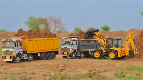 Jcb Cx Backhoe Loading Mud In Tata Truck And Tata Tipper Truck