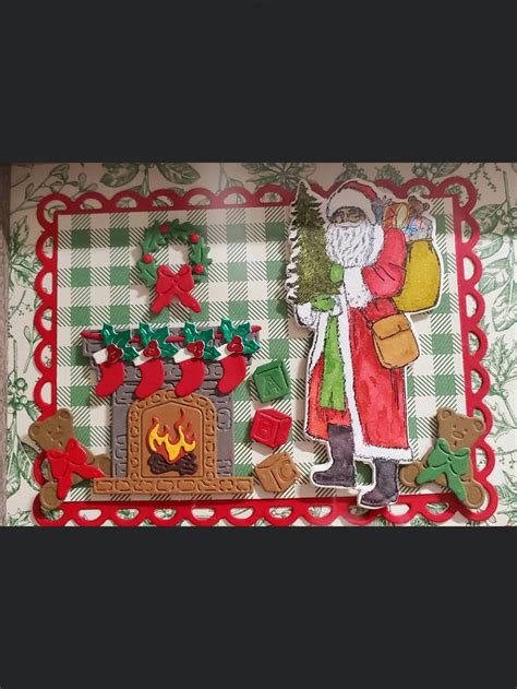 An Altered Christmas Card With Santa And His Fireplace