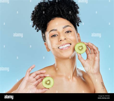 Skincare Beauty And Portrait Of Woman With Kiwi In Studio For Glowing