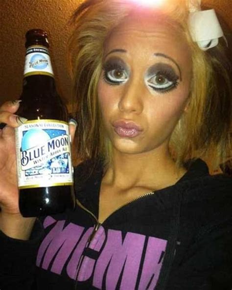 A Woman Holding A Bottle Of Beer In Front Of Her Face With Makeup On It