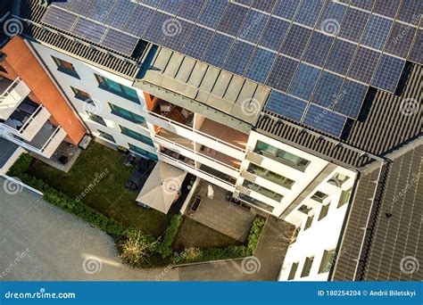 Aerial View Of Solar Photovoltaic Panels On A Roof Top Of Residential