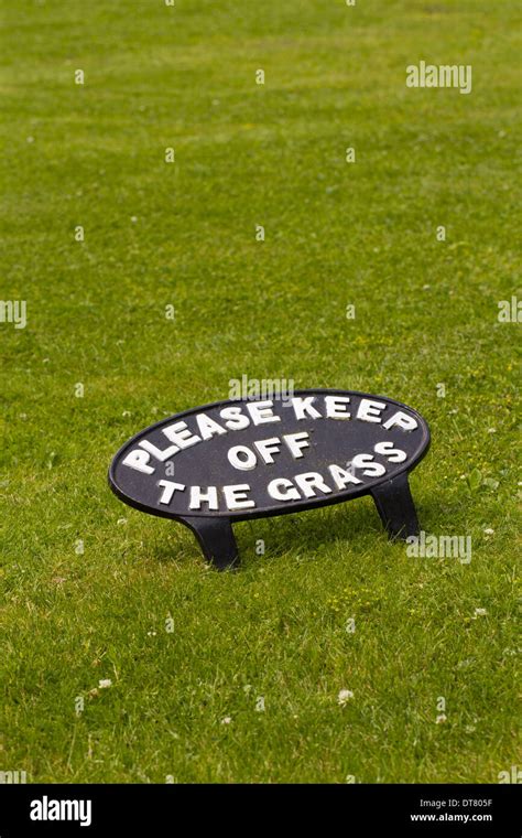 Please Keep Off The Grass Cast Iron Sign On Lawn Dyfed Wales July