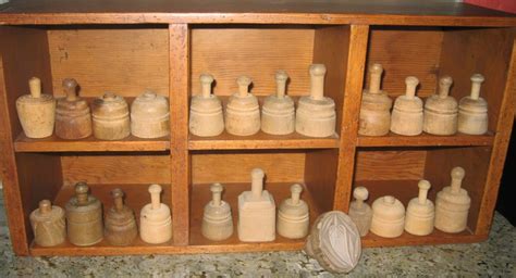 An Old Wooden Cabinet Filled With Lots Of Bottles
