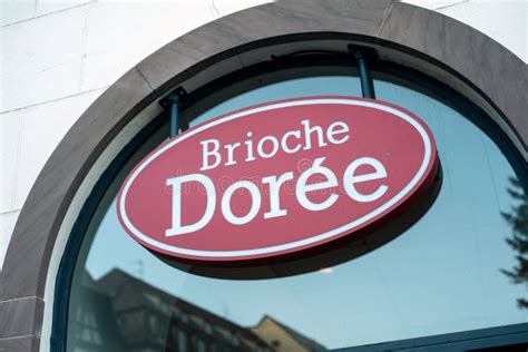 Closeup Of Brioche Doree Logo On The Famous French Bakery In The Street