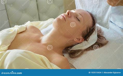 Beautiful Young Woman Relaxing With Face Massage At Luxury Spa Salon