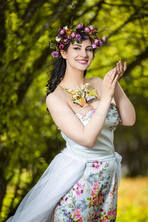 Fantastic Portrait Of Sensual Brunette Female In White Dress Outdoors Posing With Flowery