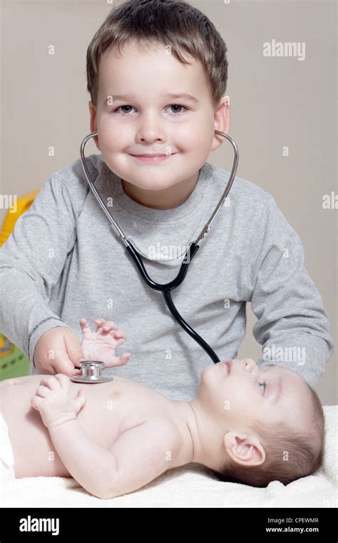 Stethoscope Listening To A Babys Heartbeat Stock Photo Alamy