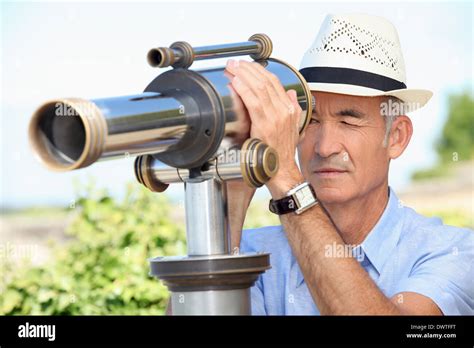 Senior Man Looking Through A Telescope Stock Photo Alamy