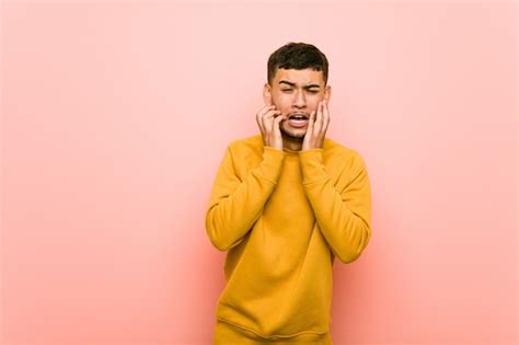 Premium Photo Young Hispanic Man Whining And Crying Disconsolately