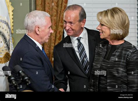 Dick DeVos Jr., center, shakes hands with United States Vice President