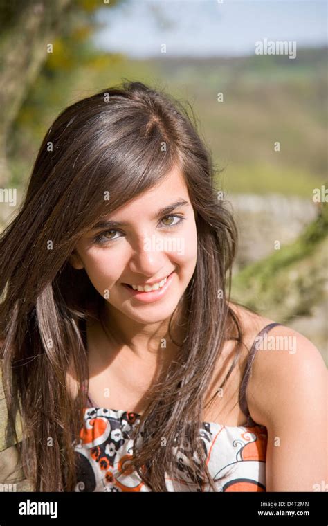 Teenage Girl Sitting Outside In The Peak District Of The Uk Stock Photo