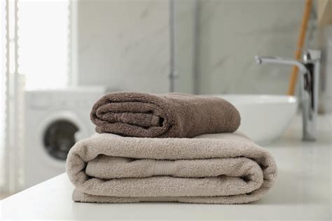 Premium Photo Stack Of Clean Towels On Bathroom Countertop