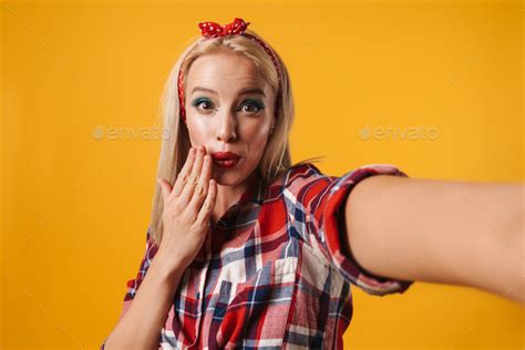 Image Of Pinup Girl Covering Her Mouth While Taking Selfie Photo Stock