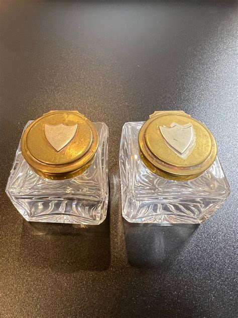 Mid Century Antique Pair Of Glass Inkwells With A Brass Lid And A