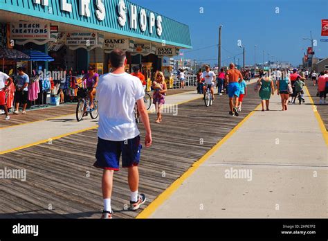 Folks Enjoy The Summers Warm Weather On The Boardwalk In Wildwood New