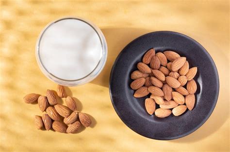 Premium Photo Milk And Almond Seeds Prunus Dulcis Closeup Image