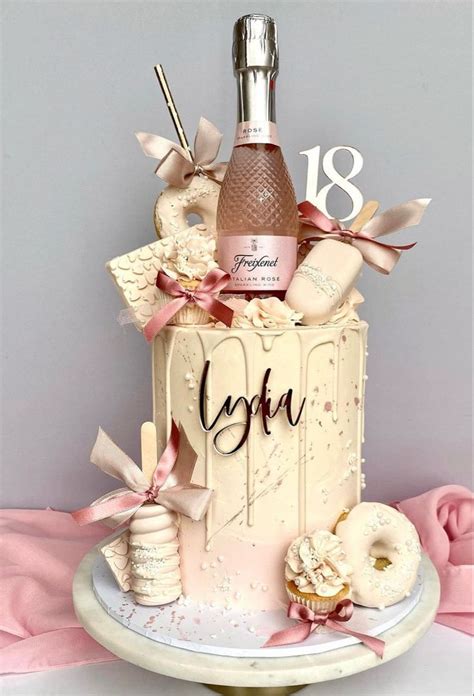 A Birthday Cake Decorated With Donuts And A Bottle Of Booze For 18th