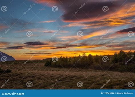 The Sunset Is Reflected In The Clouds Stock Photo Image Of Cloudy