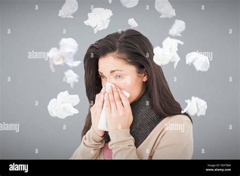 Composite Image Of Sick Brunette Blowing Her Nose Stock Photo Alamy