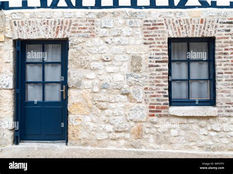 Horizontal View Of A Typical Stone House Facade In Normandy In France