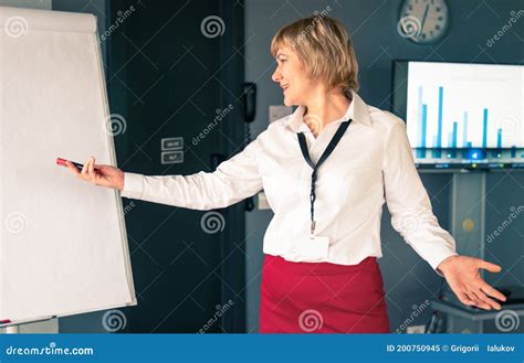 Pretty Business Woman Giving A Presentation In A Conference And Meeting