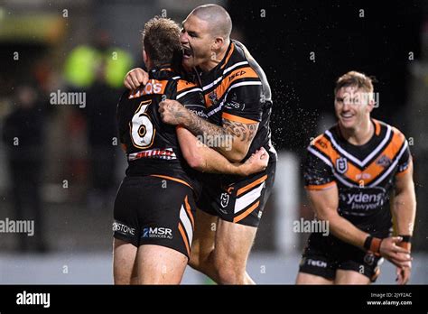 Billy Walters Of The Tigers Left Celebrates With Russell Packer After