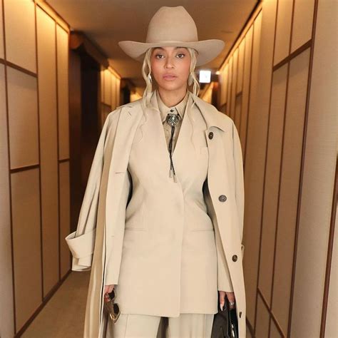 Beyoncé Dresses Up Her Sculpted All-Beige Suit With a Turquoise Bolo Tie and an Espresso Clutch