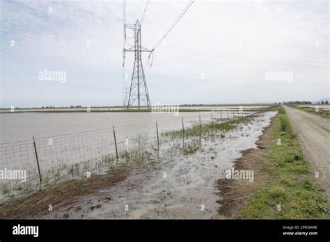 Electrical towers over flooded fields turned to vernal pools in the ...