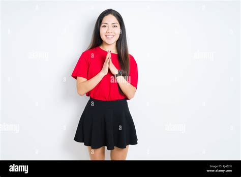 Beautiful Brunette Woman Wearing Red T Shirt And Skirt Over Isolated