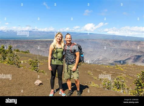 The Hiking couple seeing volcano national park from crater on the ...