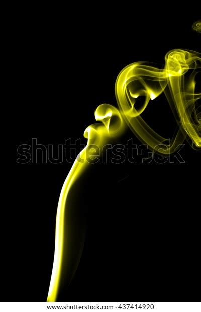 Abstract Yellow Smoke On Black Background Stock Photo 437414920