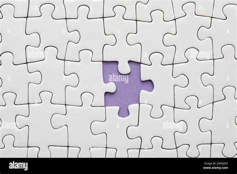 Piece Missing From White Jigsaw Puzzle Stock Photo Alamy