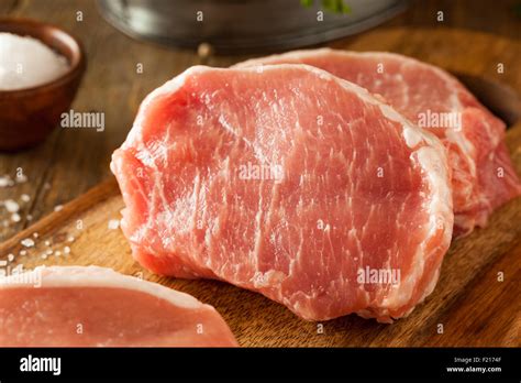 Raw Organic Boneless Pork Chops Ready To Cook Stock Photo Alamy