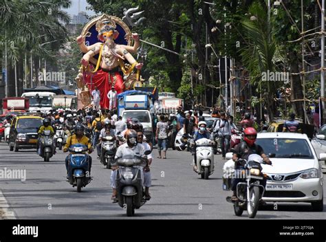 An Idol Of Elephant Headed Hindu God Ganesh Is Being Carried To A Place