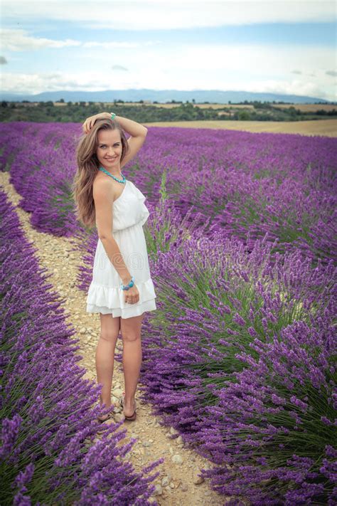 Beautiful Girl Enjoying The Scent Of Lavender Fields Stock Image