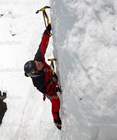 Man Climbing Frozen Waterfall Stock Photo By Vetal